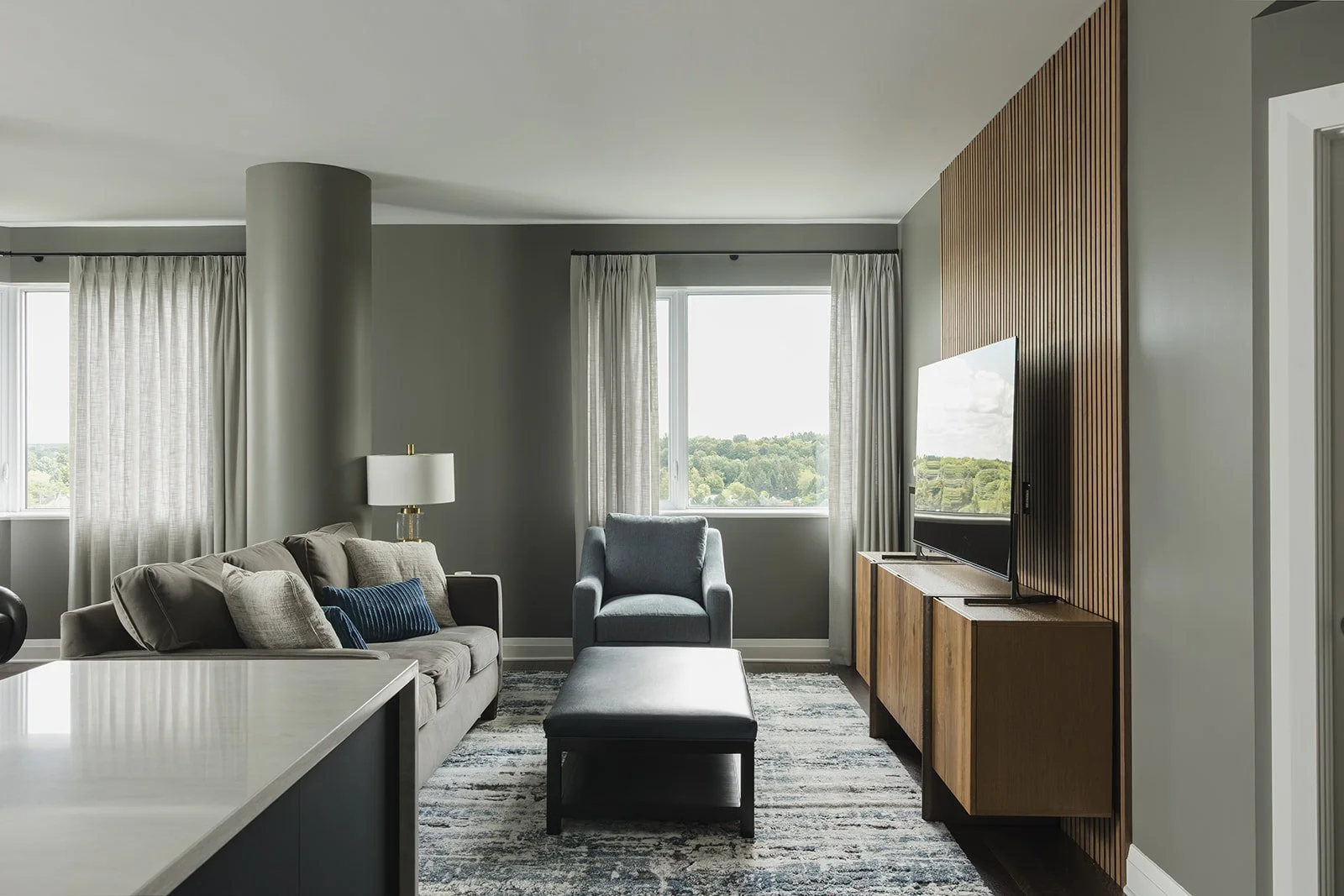 CPI Interiors luxury condo design with a slat wall