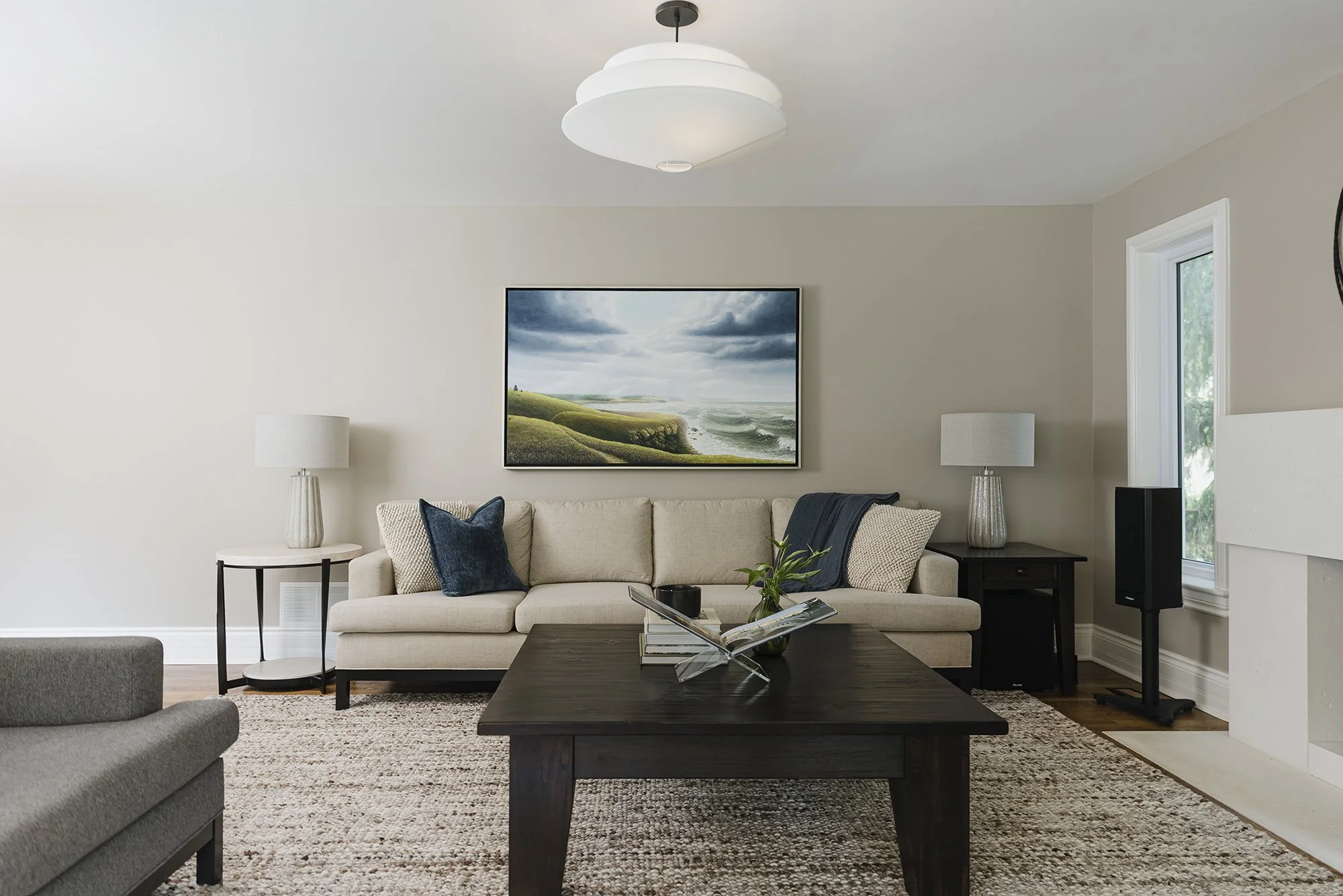 Family room design for an Ottawa family home featuring custom upholstery and a wool rug