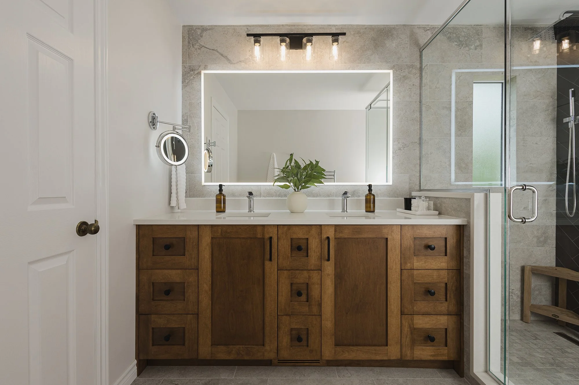 Ensuite renovation in Ottawa featuring a maple vanity with lots of drawers and an LED mirror.