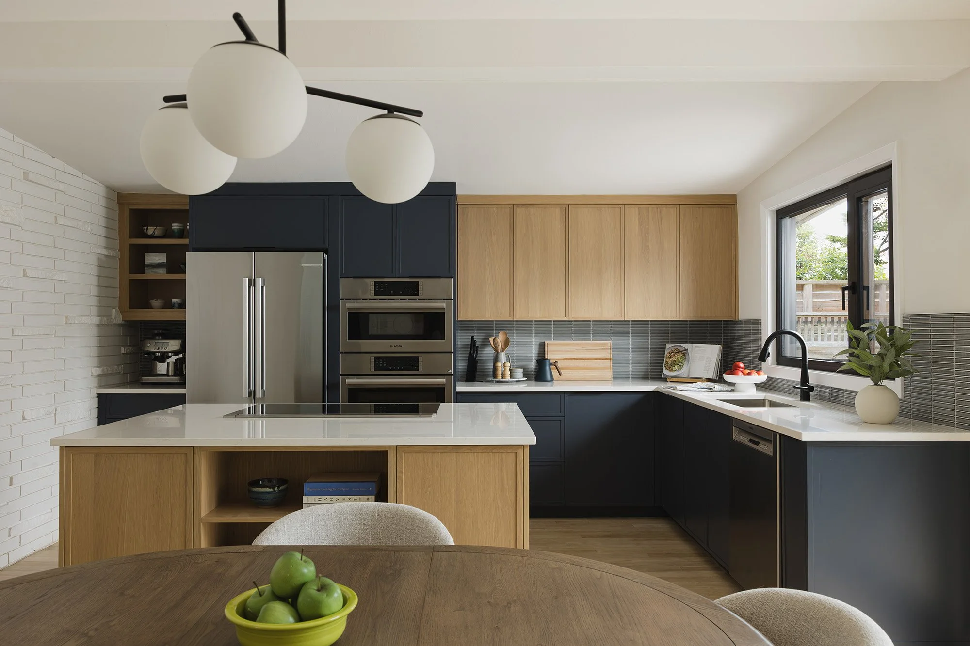 Ottawa interior design featuring a mid-century modern kitchen with white oak cabinets and a 36" cooktop.
