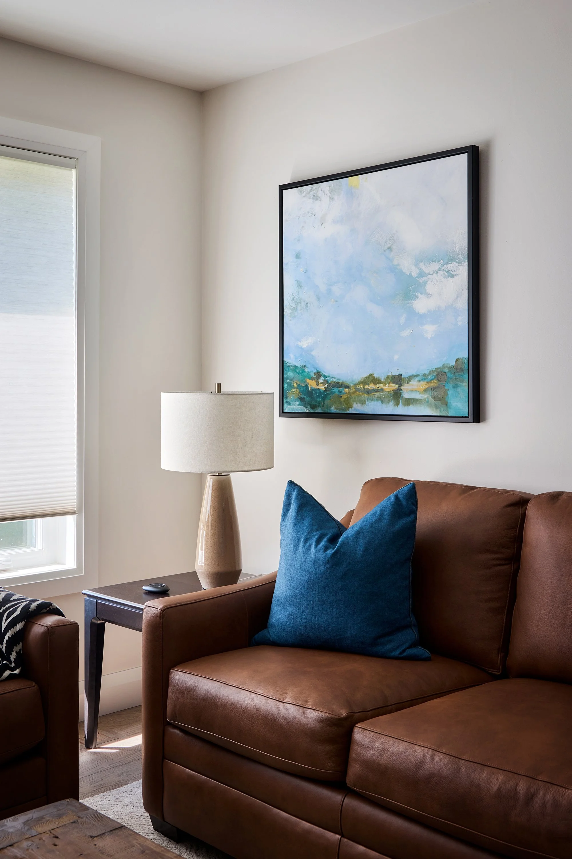 Open concept home design for an Ottawa family home featuring cognac leather sofas.