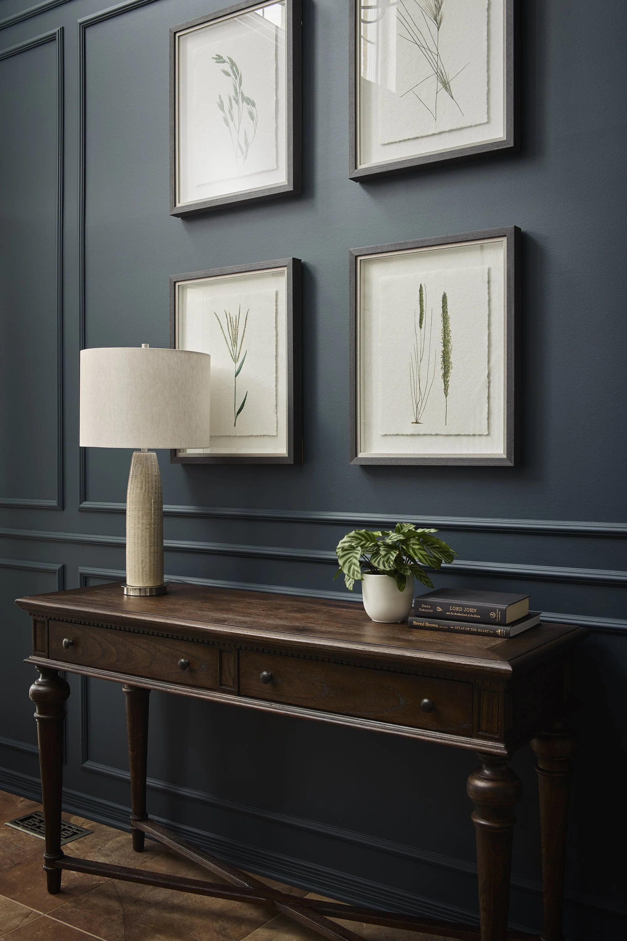Foyer renovation in Ottawa featuring decorative moulding and a traditional console. 