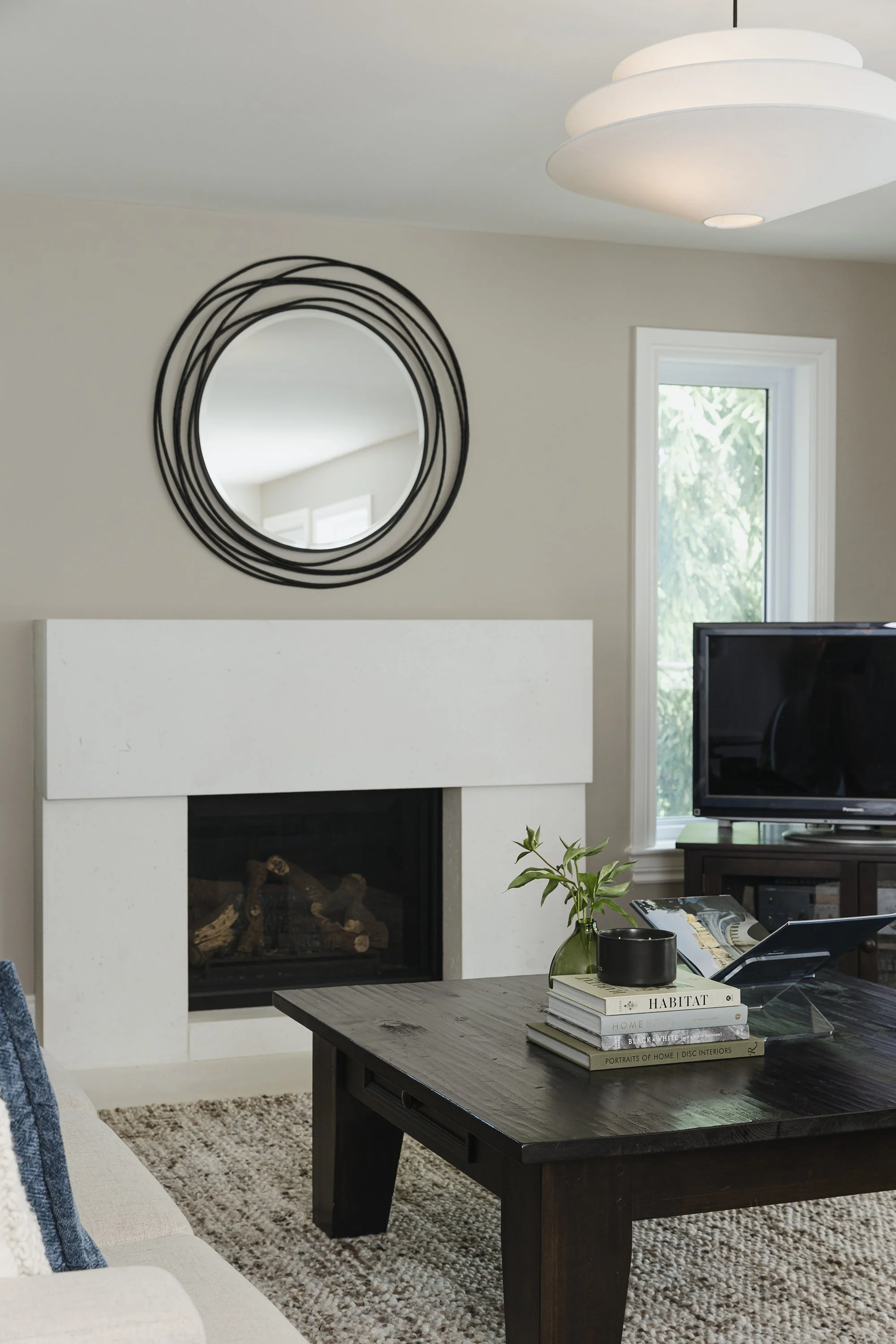 Family room design for an Ottawa family home featuring a beautiful modern fireplace.