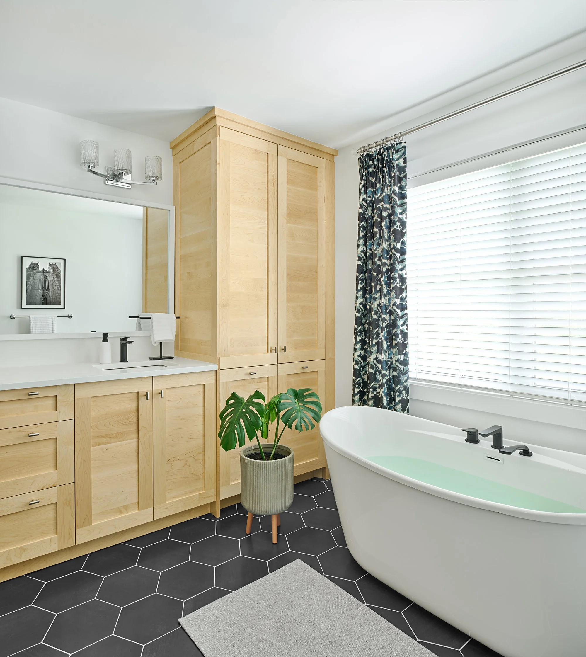 Custom ensuite renovation in Ottawa featuring natural maple cabinets and custom drapery. 