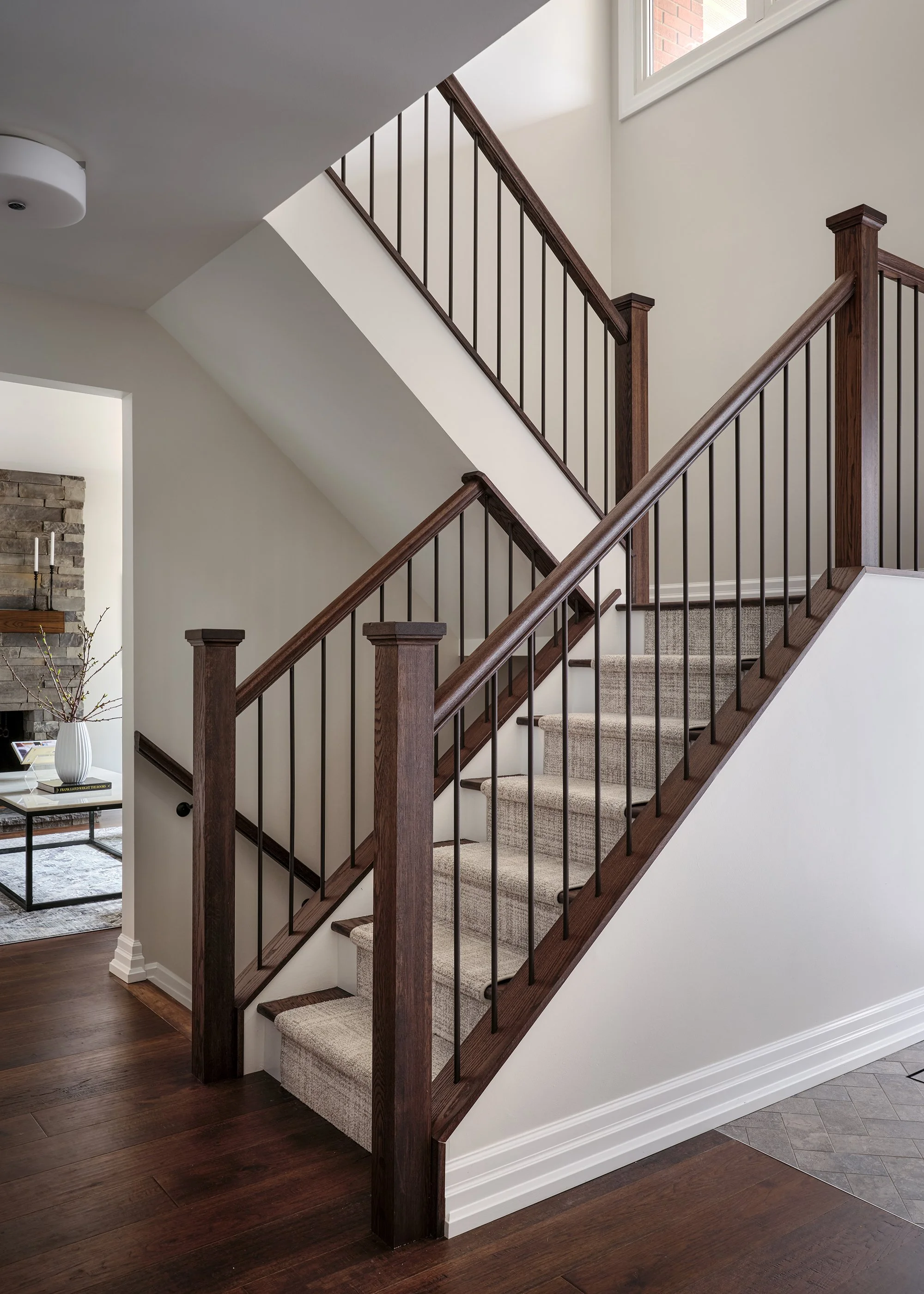 Whole home renovation for an Ottawa family home featuring an updated staircase with a patterned runner.