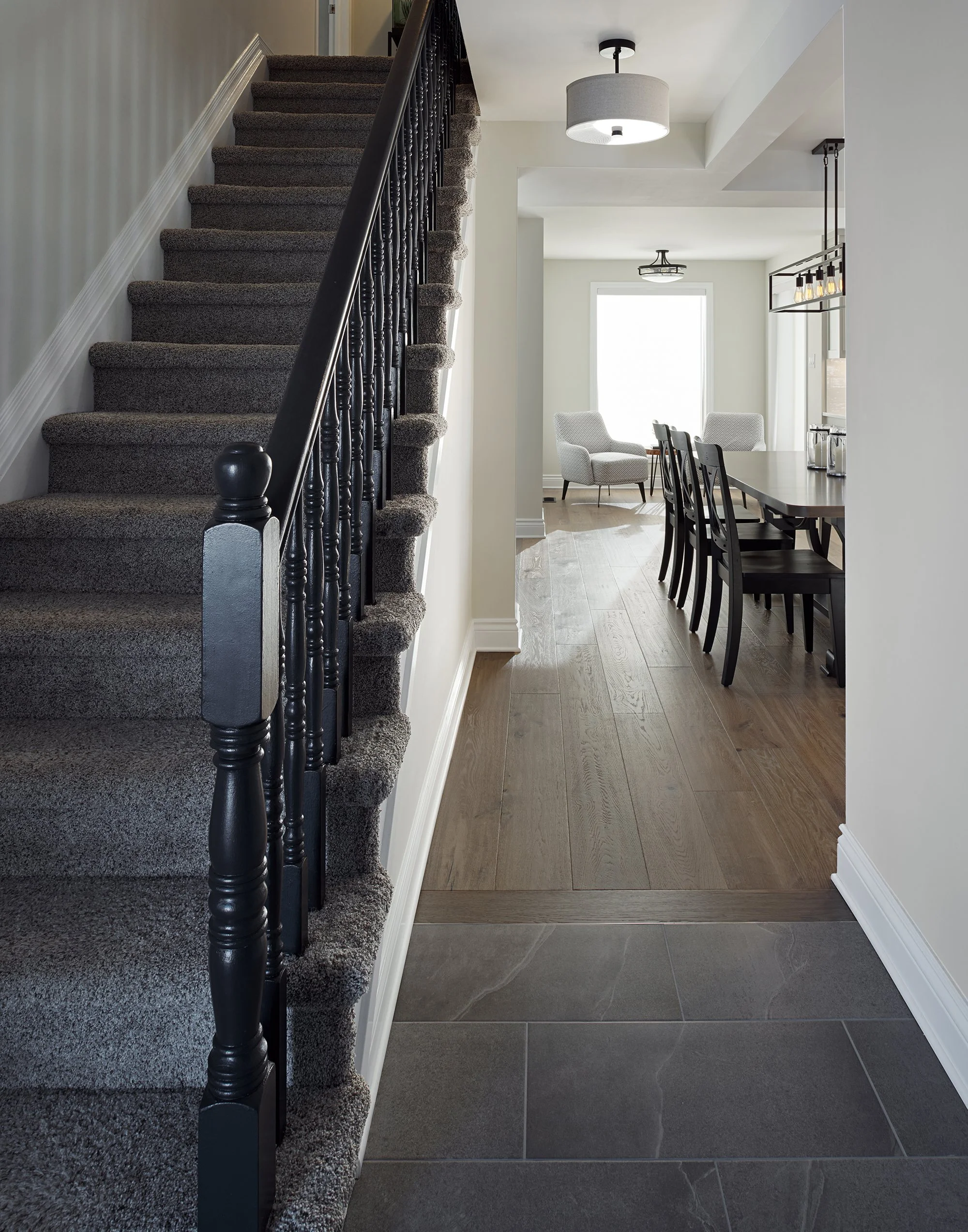 Custom open concept main floor renovation in Ottawa featuring a new kitchen, engineered flooring and updated foyer.
