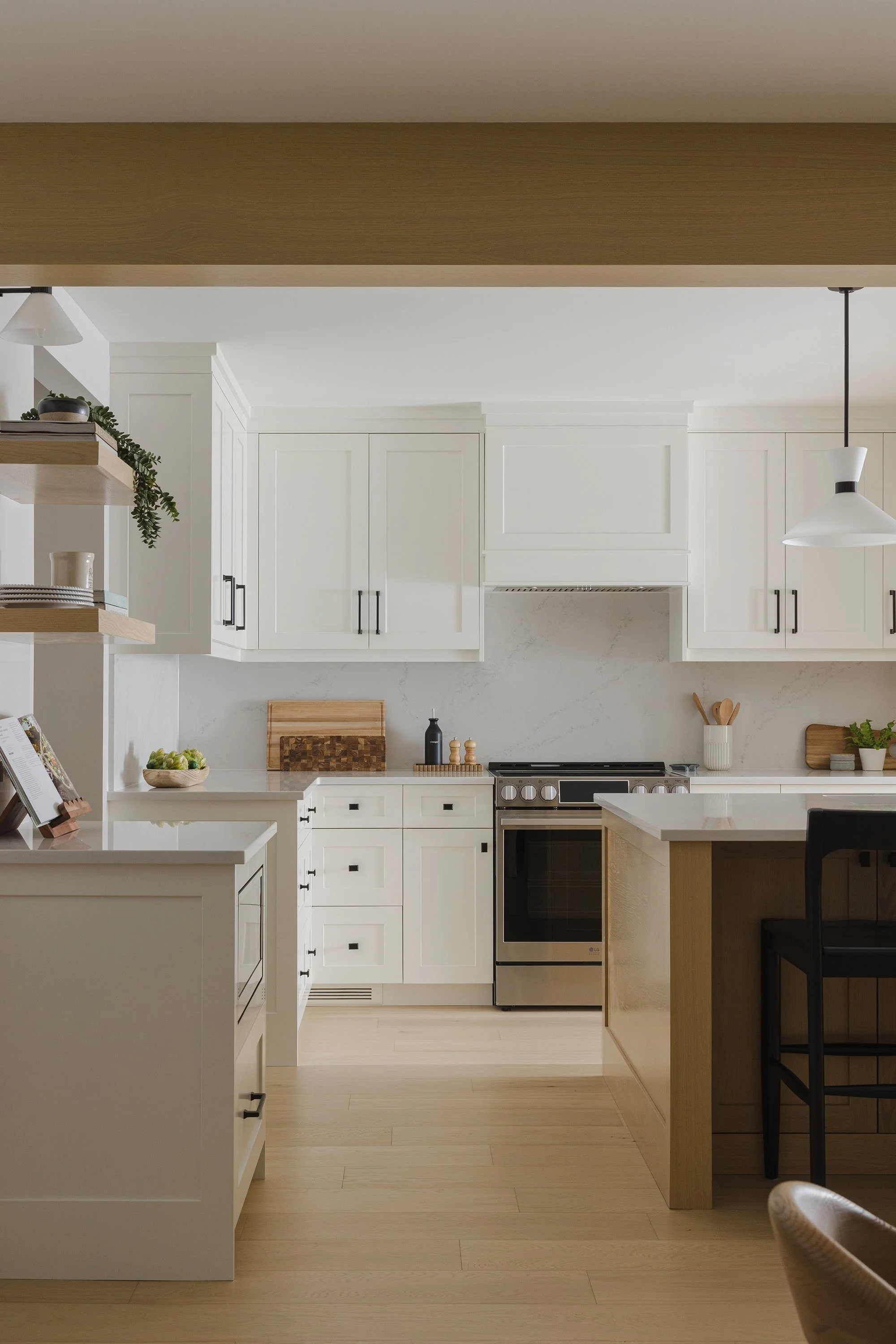 Kitchen renovation in Ottawa featuring white oak flooring and white shaker cabinets. 