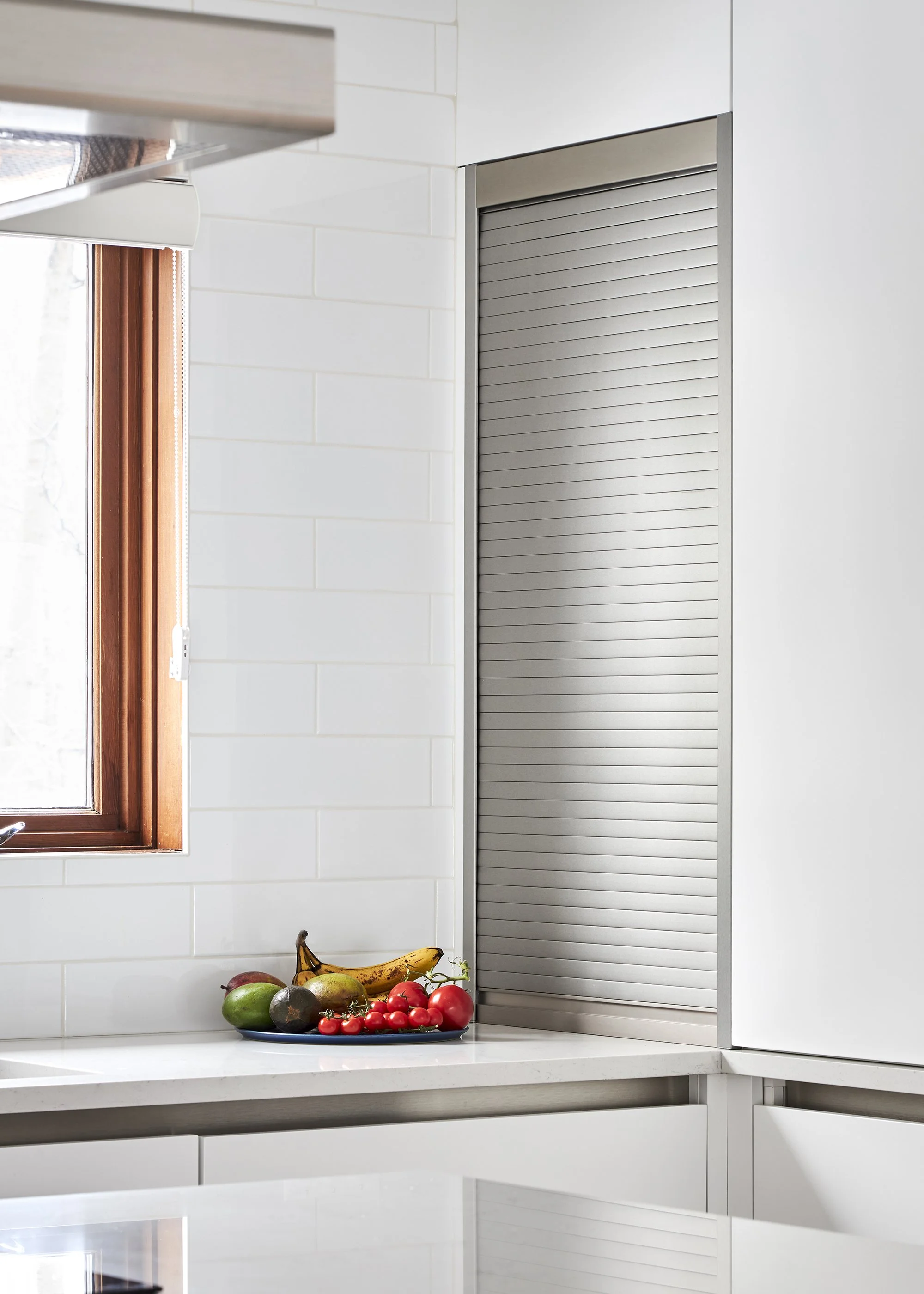 Modern custom kitchen renovation in Ottawa featuring flat panel cabinets and an appliance garage.