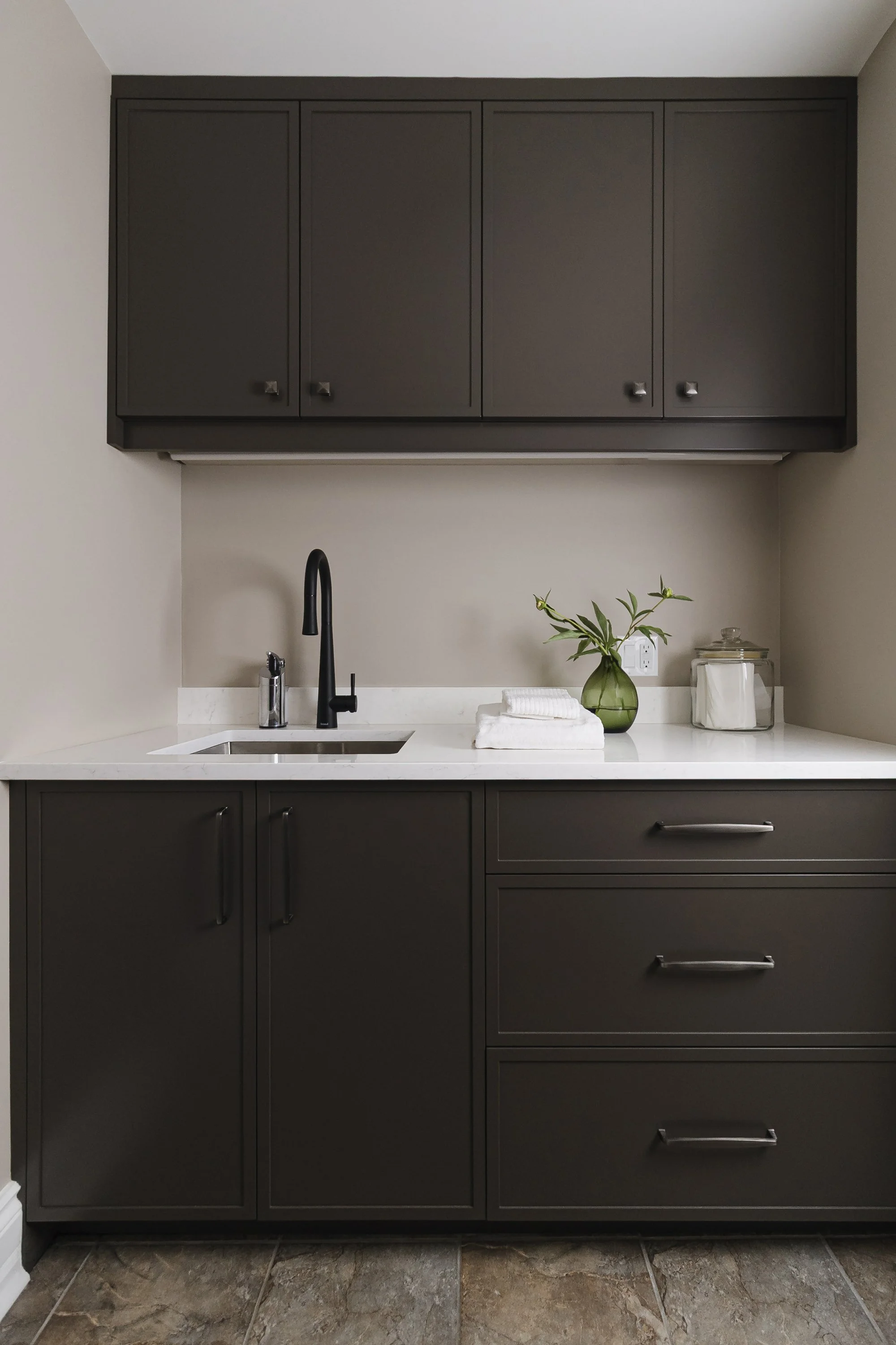 Laundry room design for an Ottawa family home featuring skinny shaker custom cabinets.