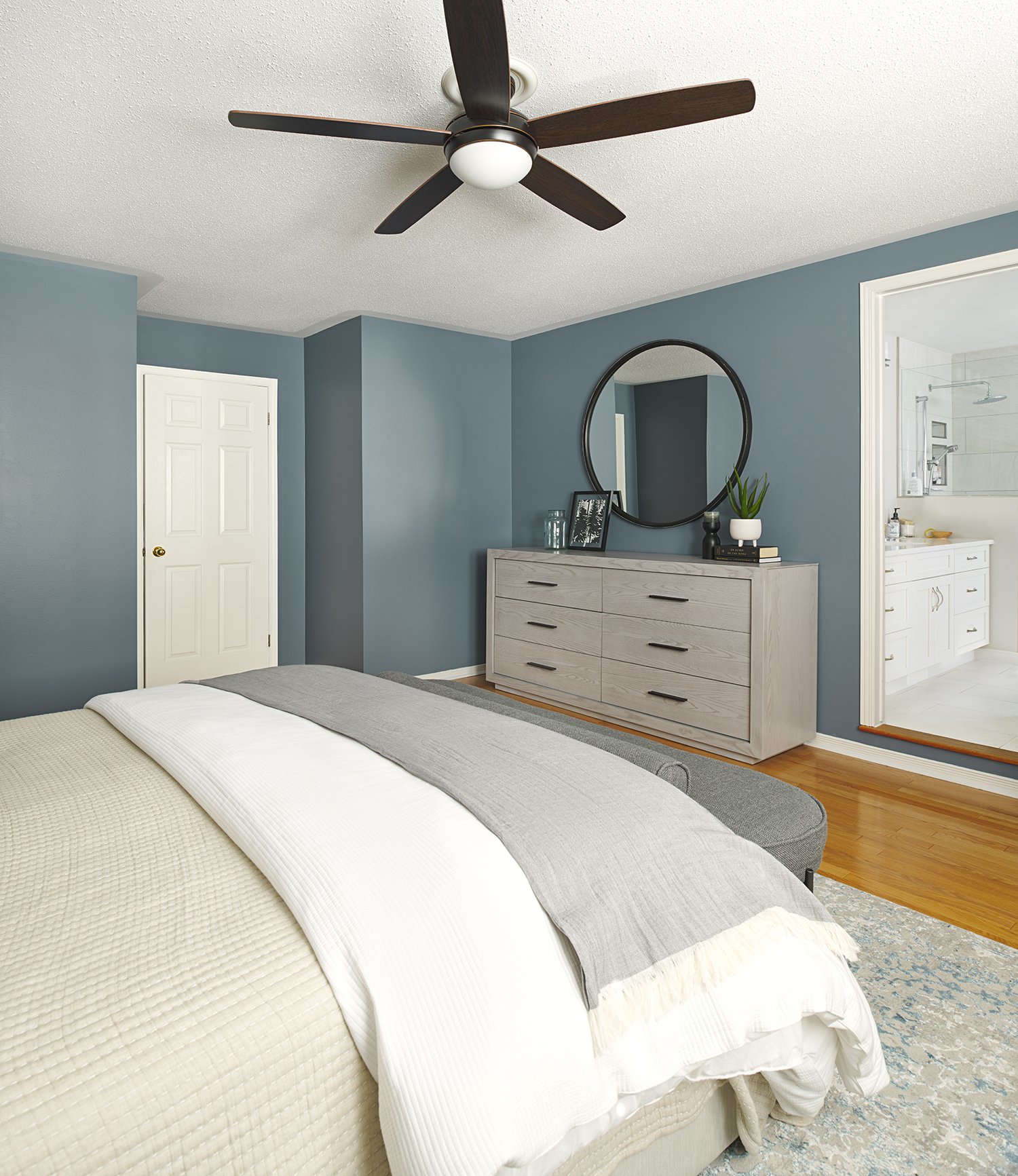 Principal bedroom design in Ottawa featuring a soothing colour scheme that coordinates with their ensuite. 