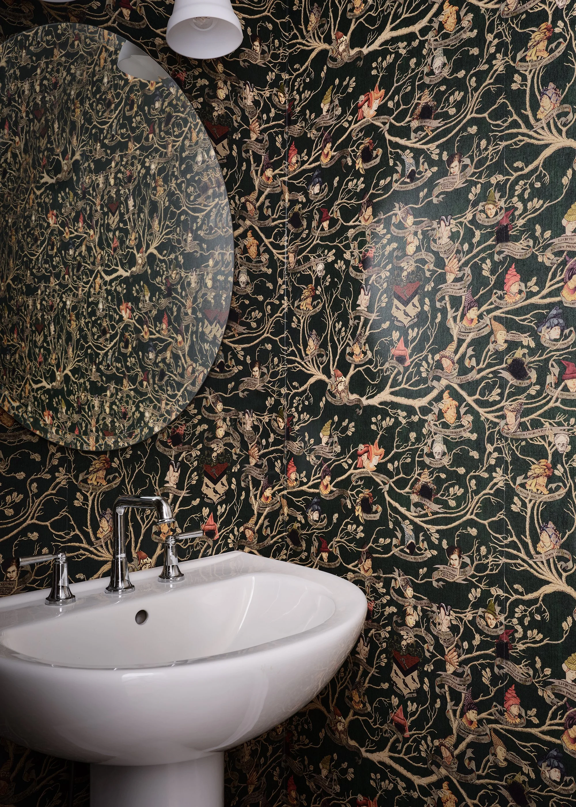 Powder room design under the basement stairs for an Ottawa family home featuring Harry Potter wallpaper. 