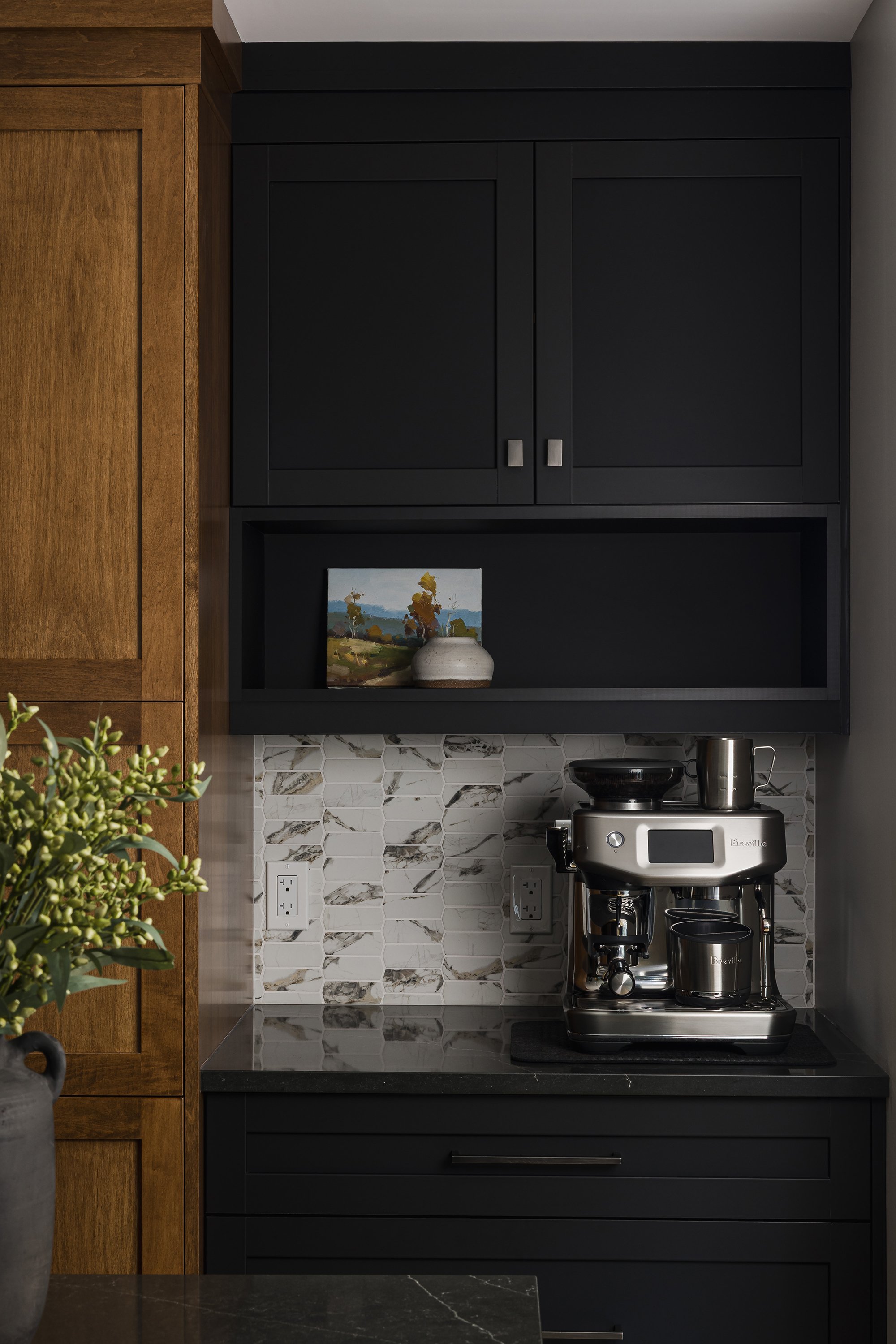 Custom kitchen renovation in Ottawa featuring a contrasting black coffee bar with an open shelf. 