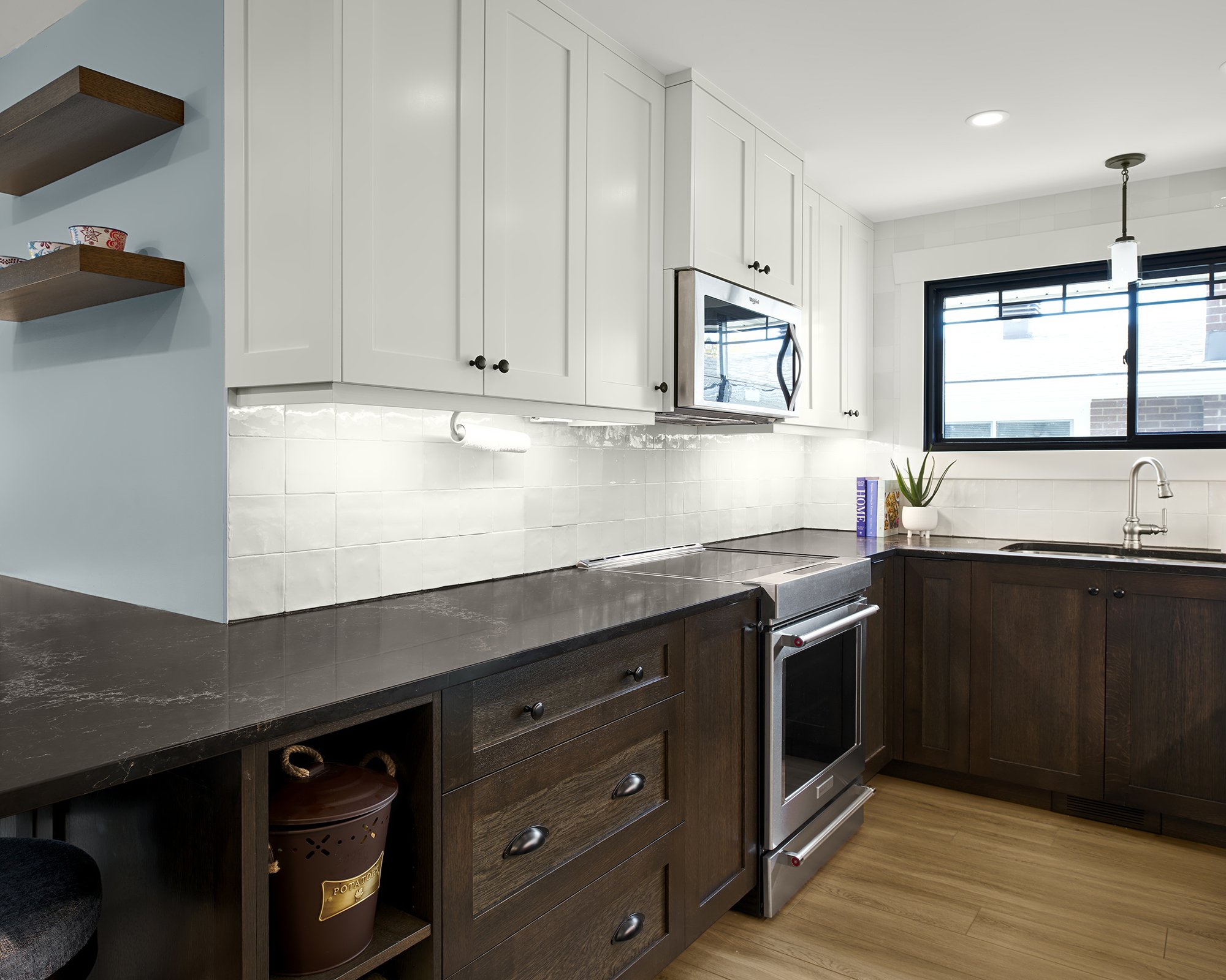 Custom craftsman style kitchen renovation in Ottawa featuring open shelves for produce.