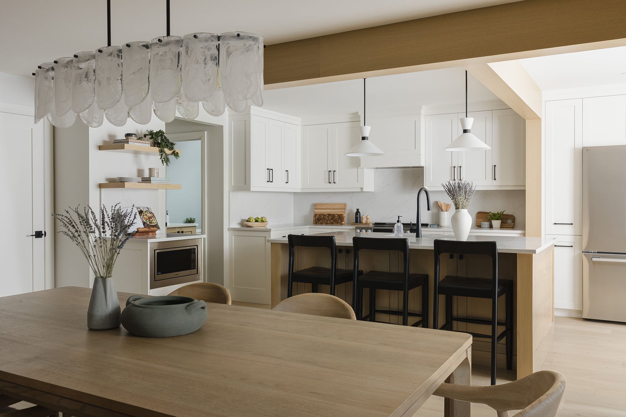 Kitchen renovation in Ottawa featuring white oak flooring and white shaker custom cabinets.
