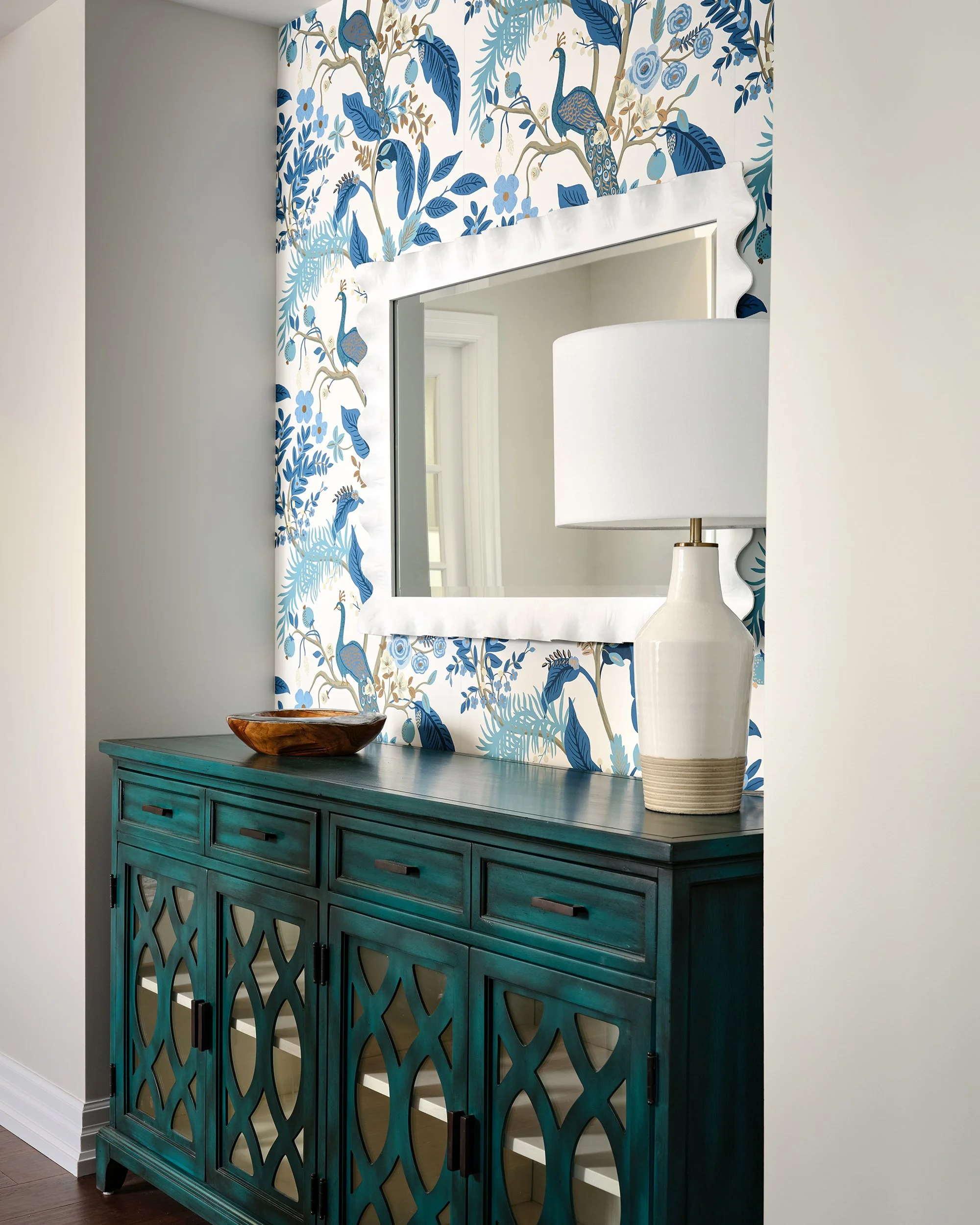 Whole home renovation for an Ottawa family home featuring floral wallpaper in the foyer.