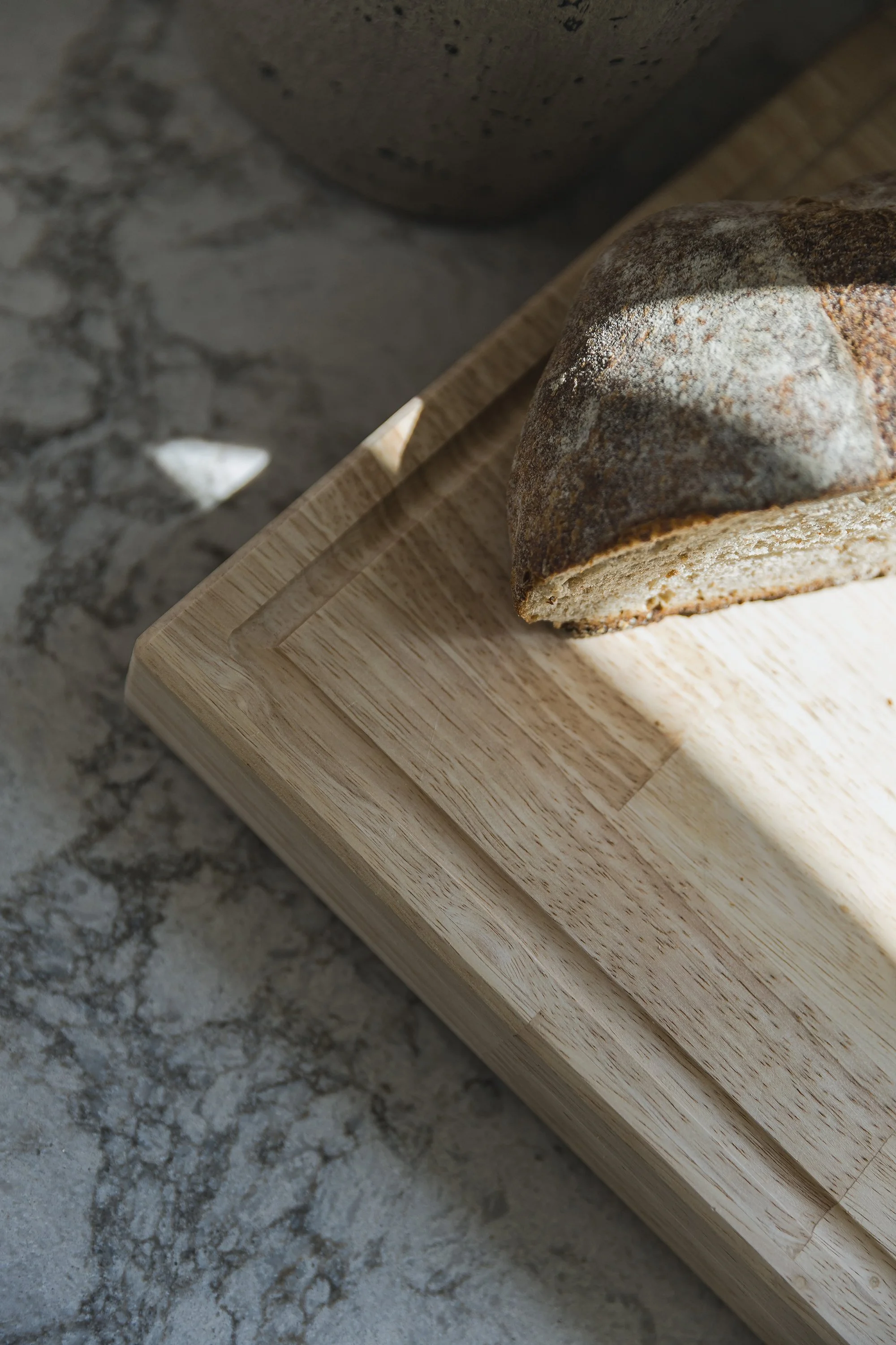 Custom kitchen design for an Ottawa family home featuring neutral quartz counters.