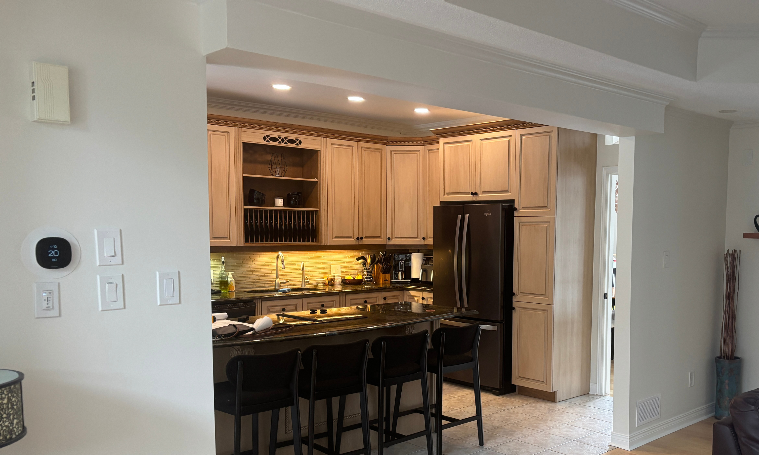 Kitchen renovation Ottawa before photo featuring pickled oak cabinets and a plate rack. 