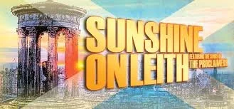 Sunshine on Leith film featuring ruins of ancient columns and a colorful background