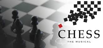 Black and white chessboard with three chess pieces, a red pawn, and checkered pattern with the text 'Chess: The Musical'.