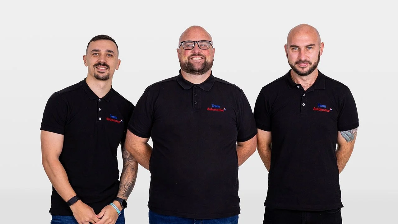 TeamAutomotive leadership team members Joss Holford, Ross Goode, and Ben Cooper smiling together