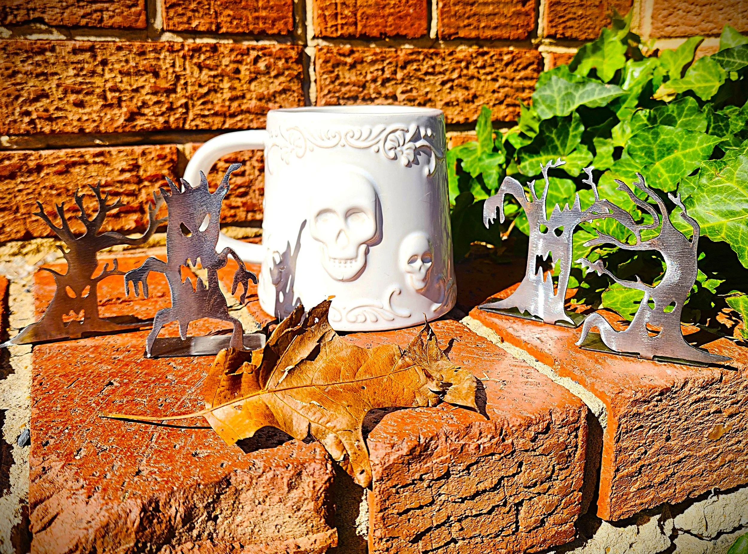 skeleton cup with scary metal trees Spiral Roots LLC