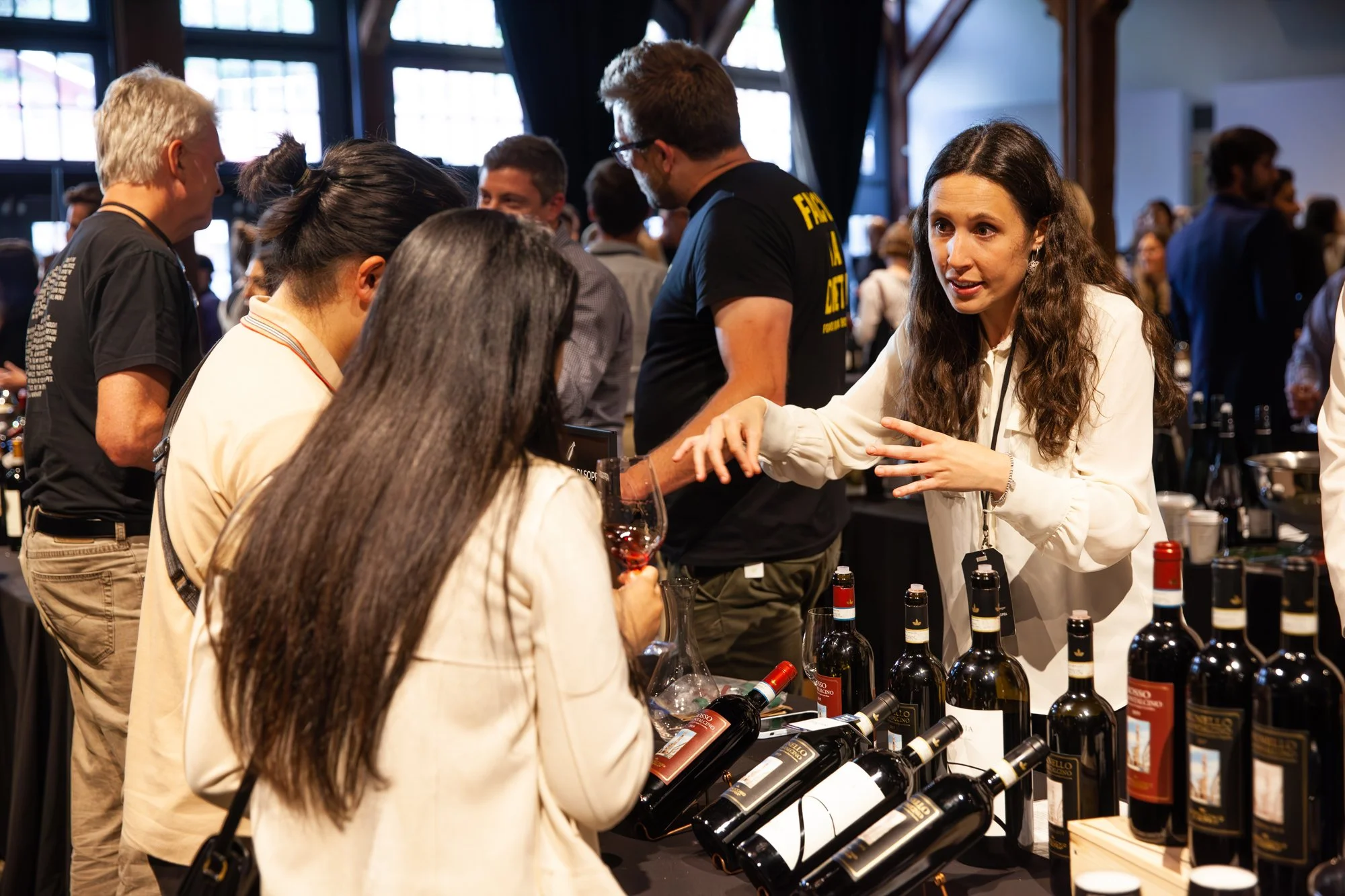People at a wine tasting event, meeting small producers from British Columbia and globally at Top Drop Canada Wine festival in Vancouver