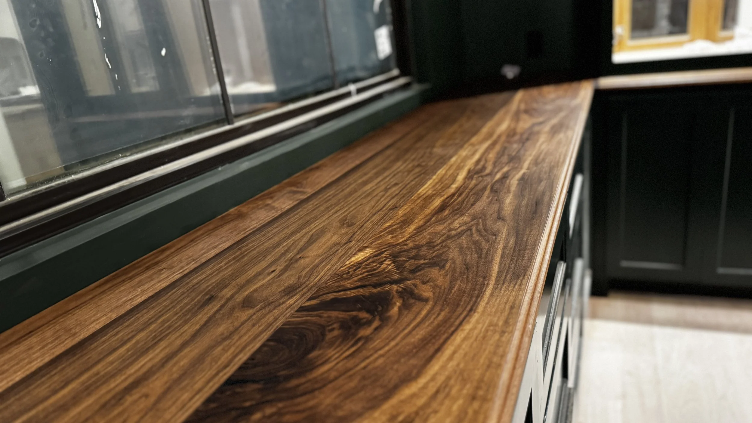 Highly figured solid black walnut countertops stretching an 11 foot span
