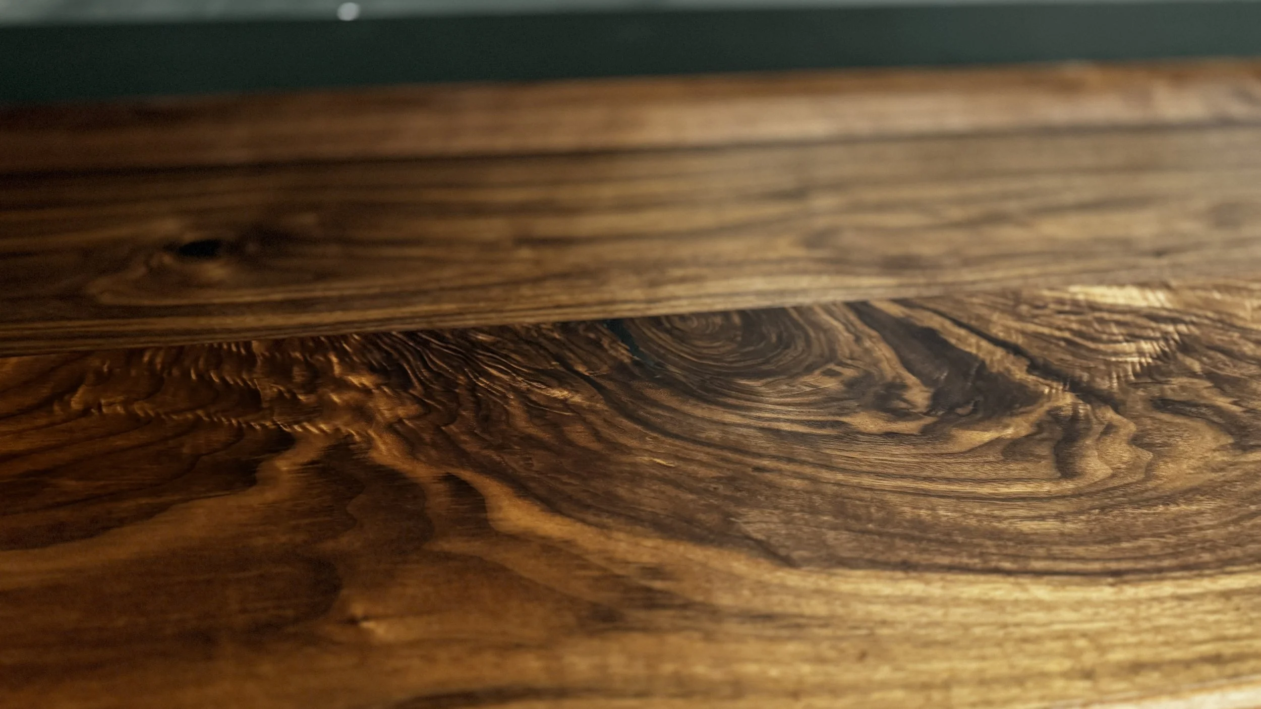 Close-up photo of highly figured walnut that was installed in a custom home in the DFW area of Texas.