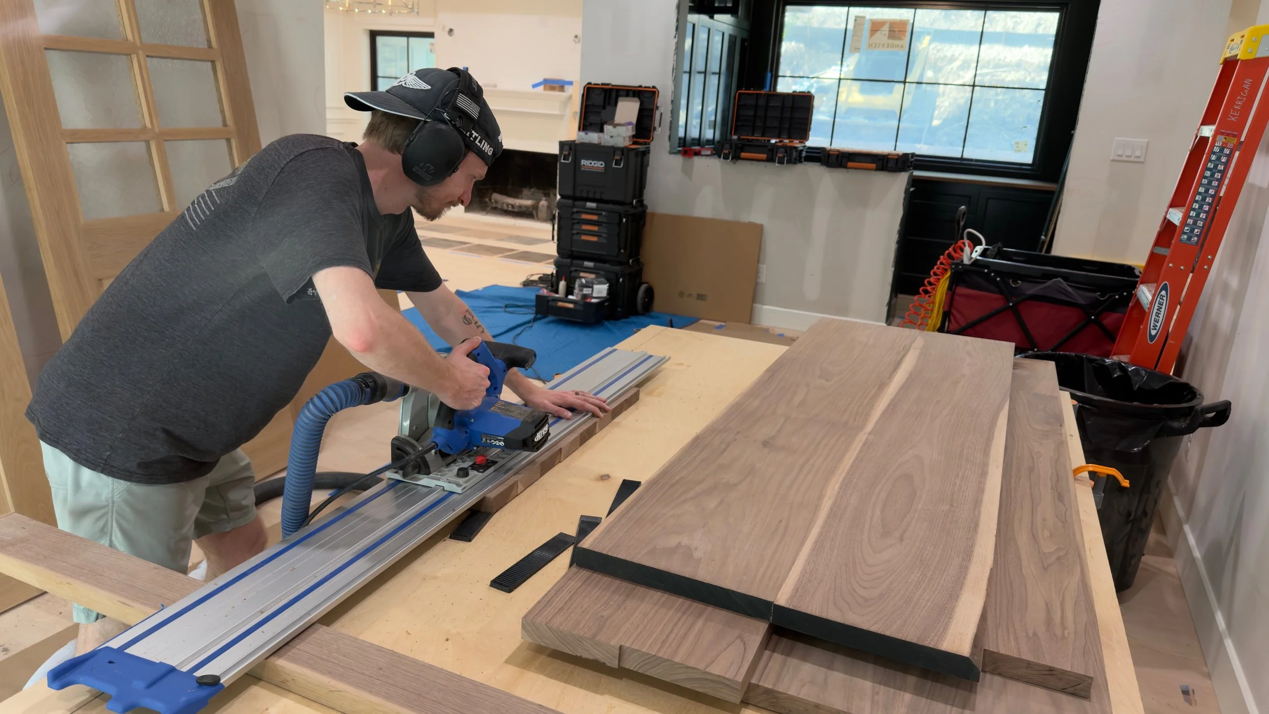 Detail shot of the owner of 5K Woodworks cutting a walnut countertop panel to final size for install