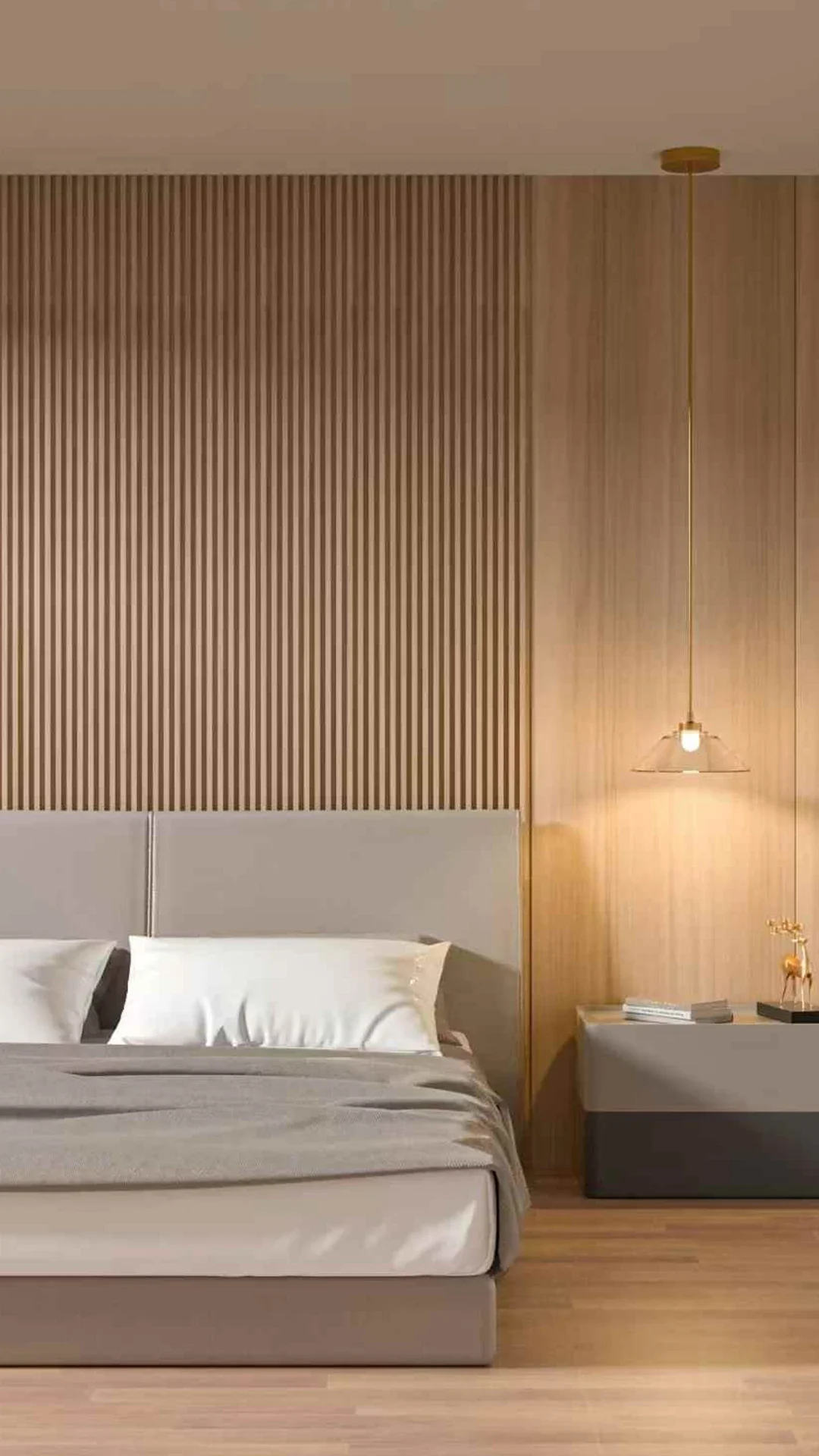 Dormitorio con pared de madera con listones, cama con cabecera gris, lámpara colgante, mesita con libros y decoración