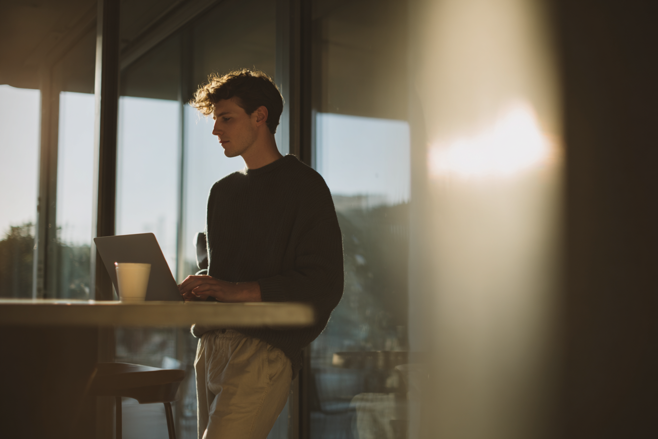 Physiology of sedentary behavior, young man working standing