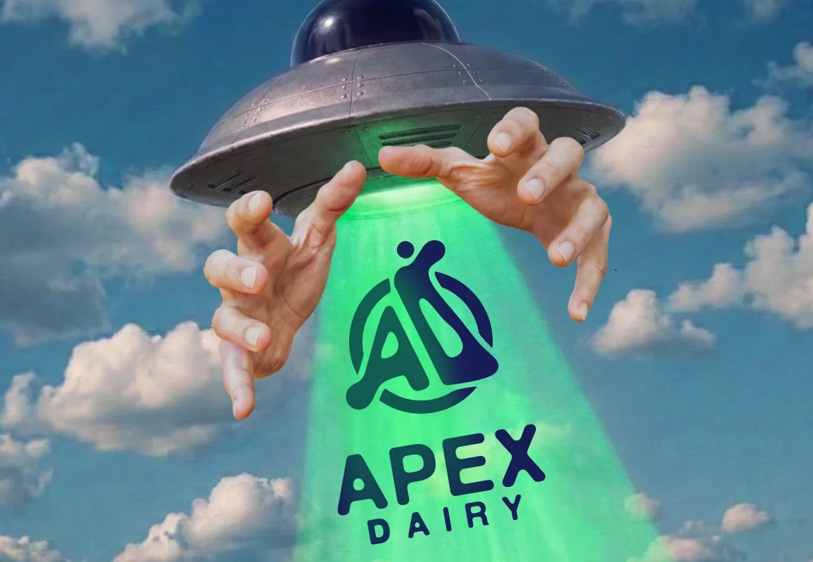 A UFO is dropping green light with an 'Apex Dairy' logo, consisting of a stylized cow and the words 'Apex Dairy' in the light.