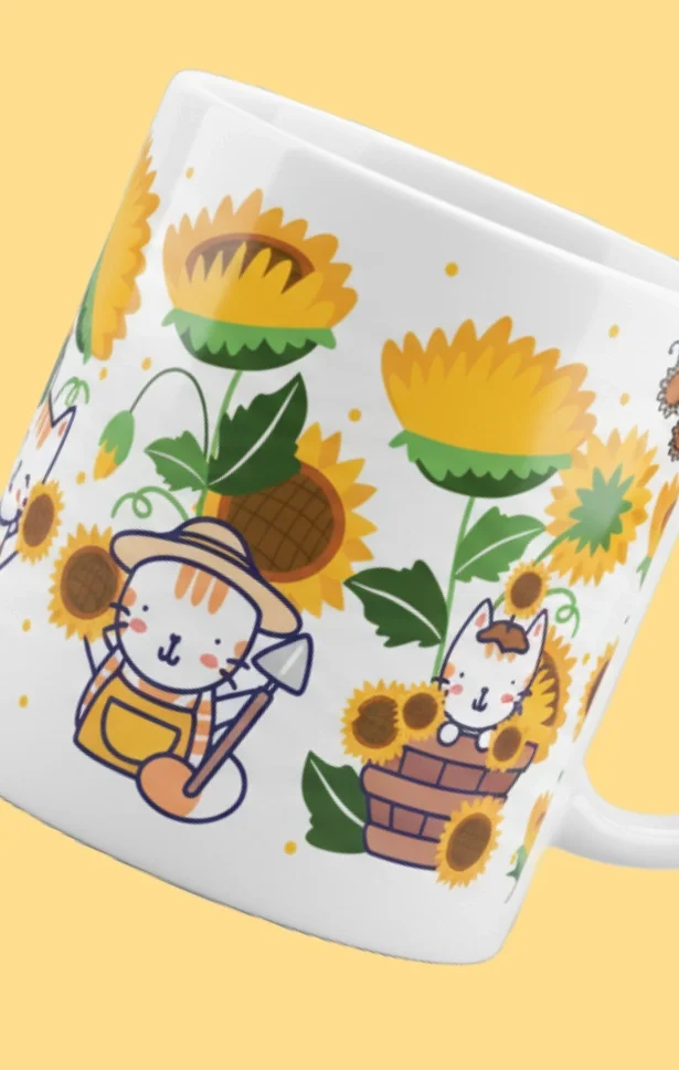 Close-up of a white mug featuring a cartoon design of sunflowers and cute animals, including a cat with a hat and a smiling bunny, with a yellow background.