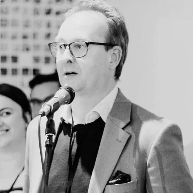 Colin Taylor, photographer, speaking at an event