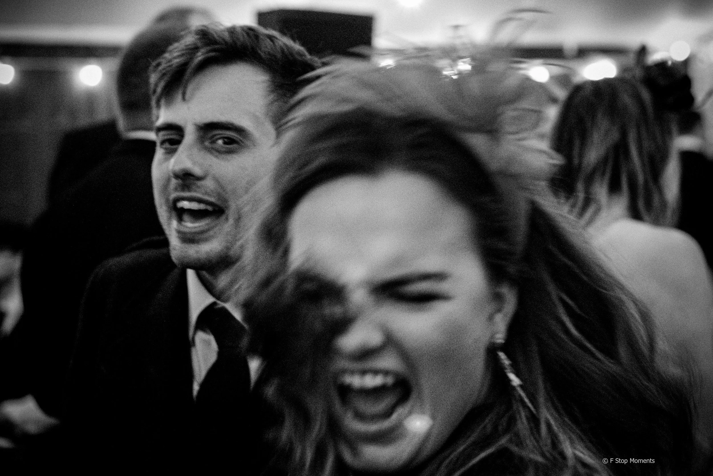Black and white image of a couple dancing  and having fun.