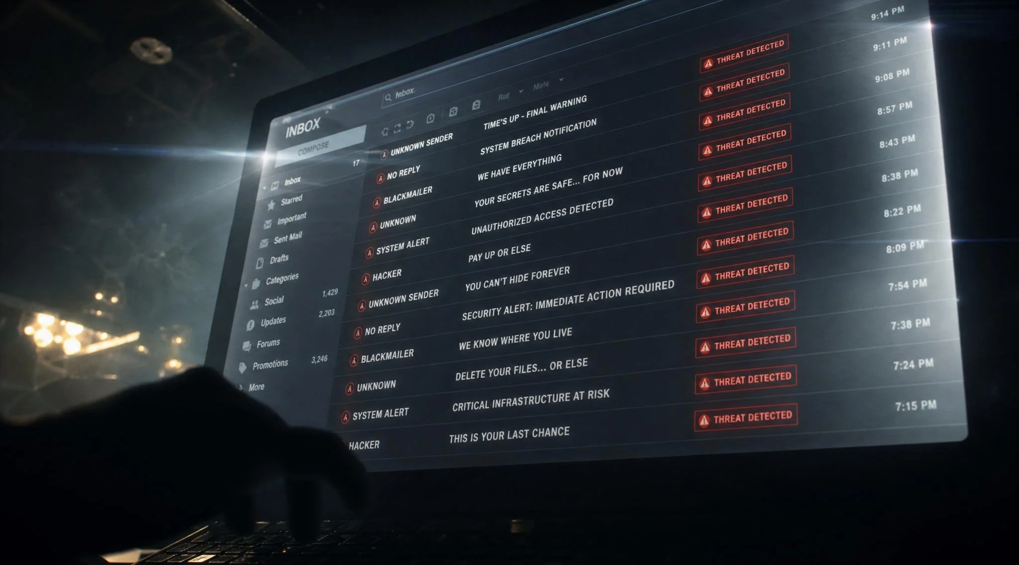 close-up of computer monitor displaying email inbox, multiple emails visible with red threat indicators