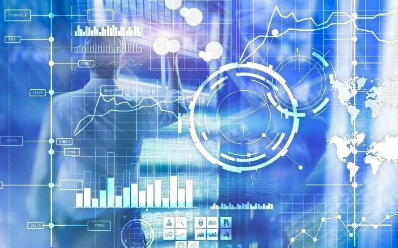 Digital interface with charts, graphs, and data visualizations over a blurred person in a business suit, representing data analytics and technology.