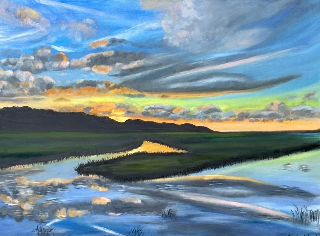 Painting of a sunset over a marsh flowing through grassy fields and distant hills, with colorful clouds and reflections on the water.