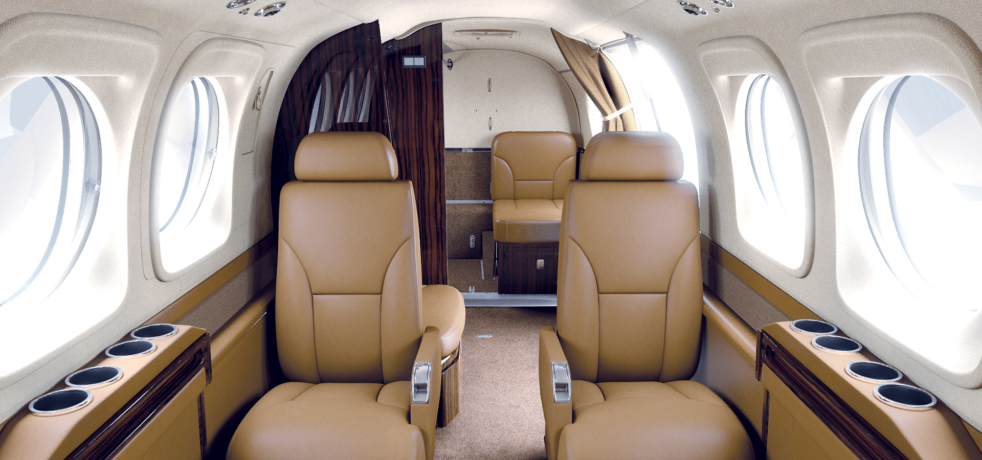 Interior view of a private jet cabin with tan leather seats, oval windows, and wood paneling, showing four seats arranged facing each other.