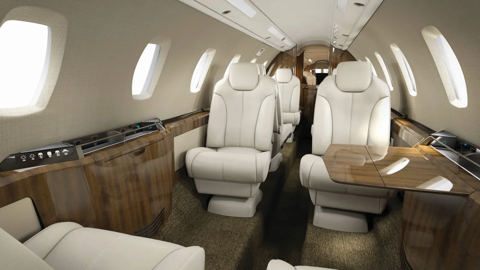 Interior of a private jet with cream leather seats, wooden accents, and multiple windows.