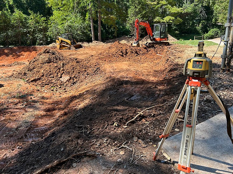 Laser level checking grade on a site preparation job
