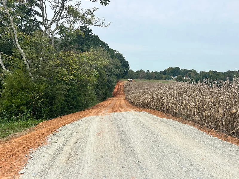 Finished gravel road along corn field