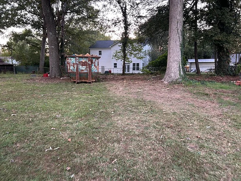 Cleared yard behind a home after debris removal