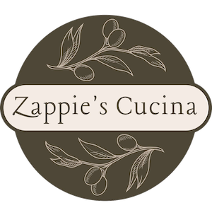 Logo for Zappie's Cucina featuring a brown circular background with olive branch illustrations and the restaurant name in the center.