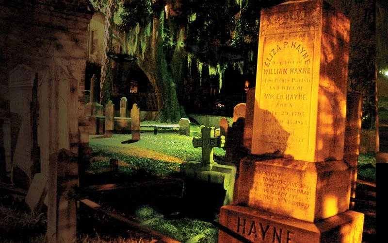 Haunted Graveyard in Charleston, SC. Gravestones after dark.