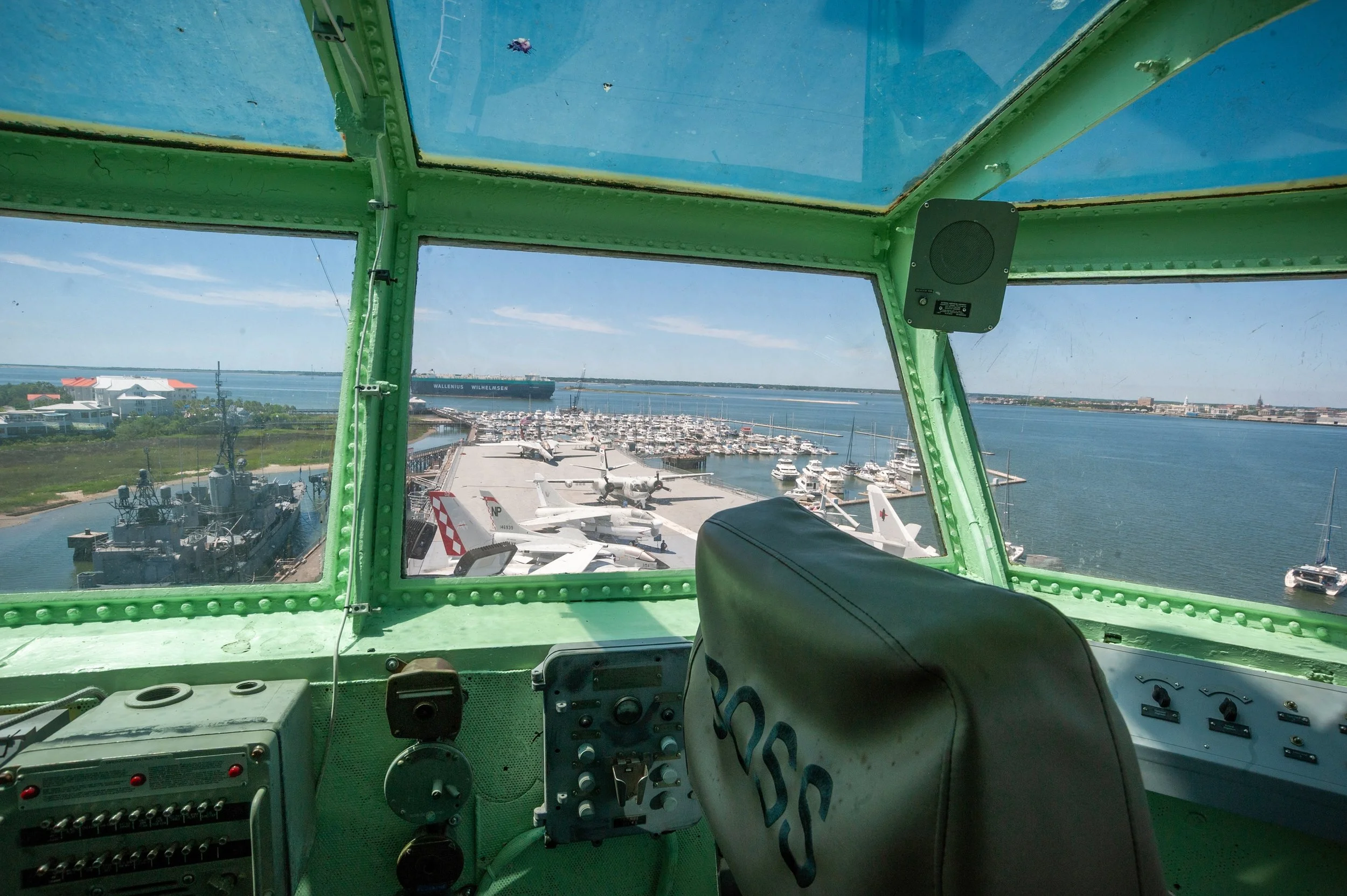 a view of USS Yorktown through the window of the captains deck