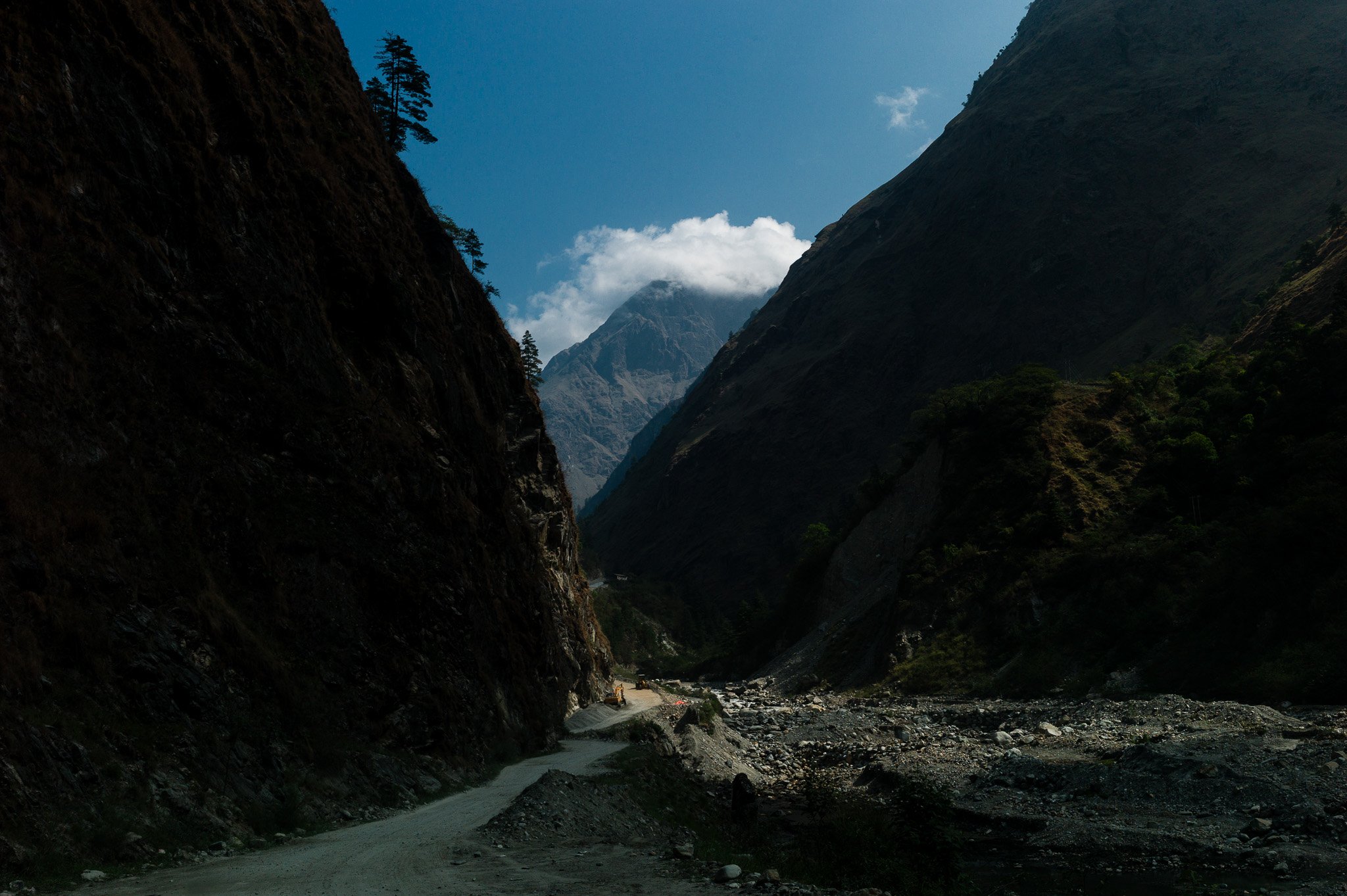 A narrow road running through a deep gorge in Nepal.