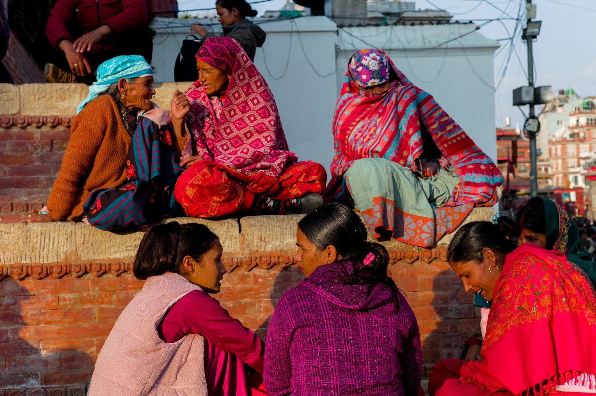 A group of Nepali women conversing on a street in Kathmandu