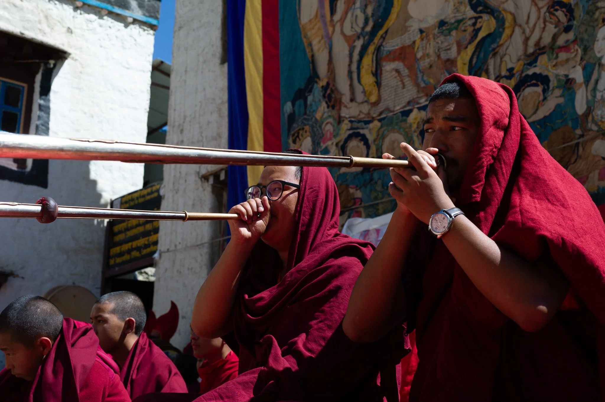 Monks blowing horns at the Tiji Festival in Mustang