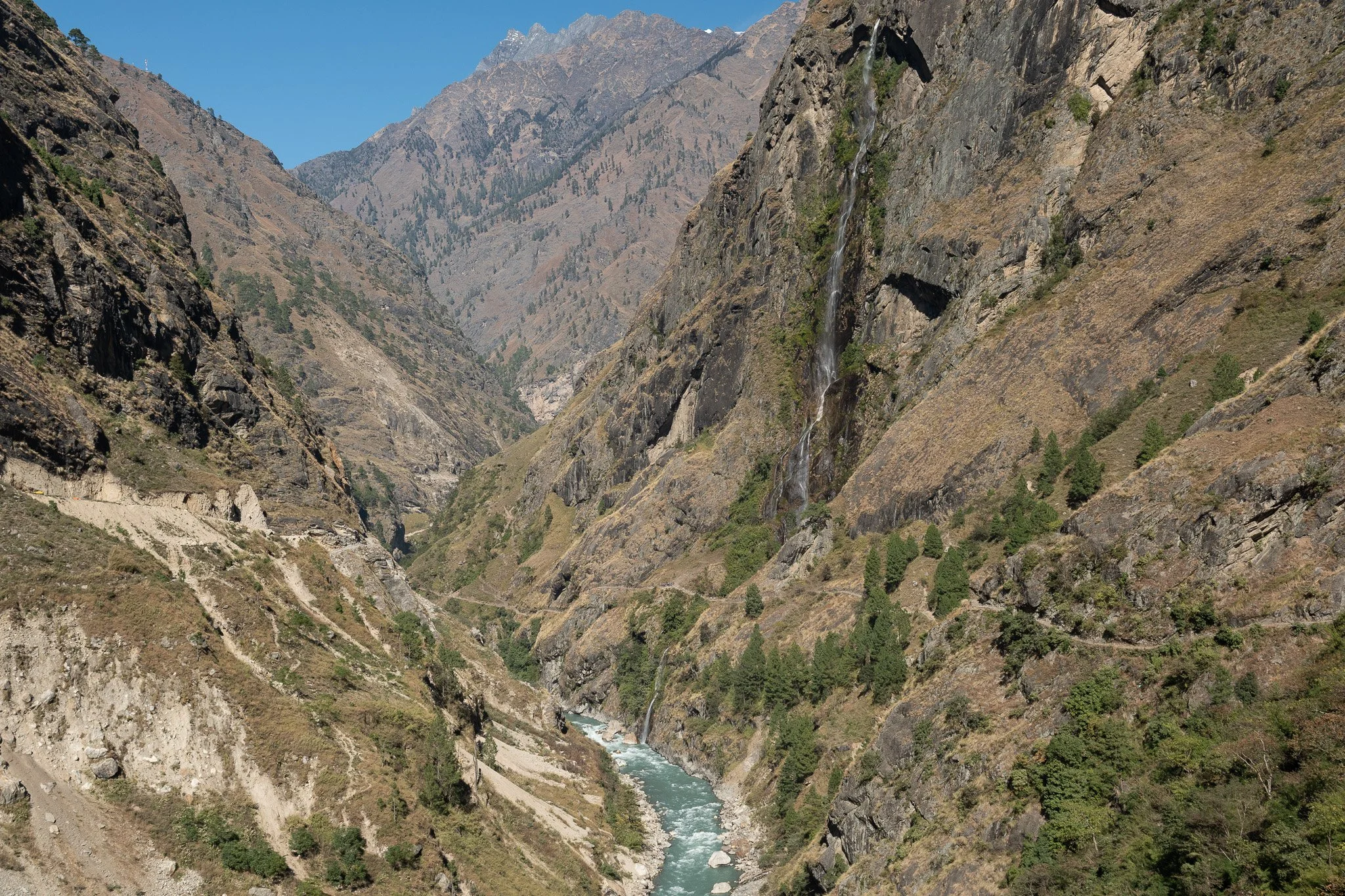 A huge waterfall crashing into the Budhi Gandaki river on the Manaslu Circuit